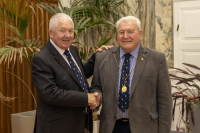 Outgoing Moderator Sandy Scrimgeour hands over the chain of office to Bill Duncan 3 September 2024